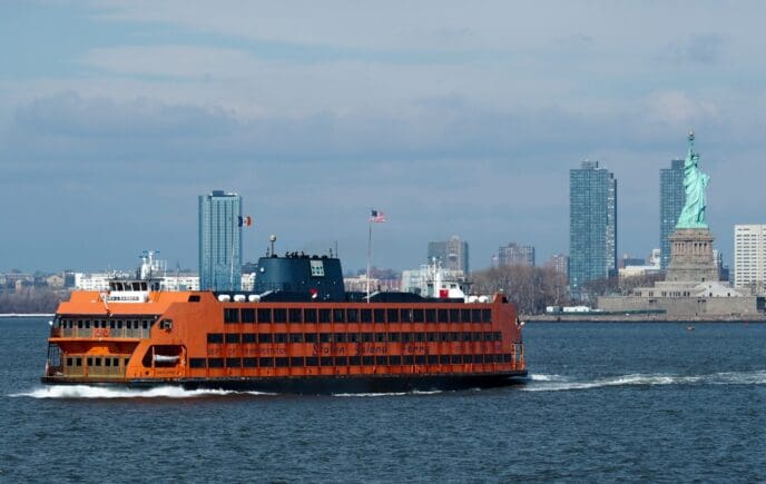 Staten Island Ferry in front of The Statue of Liberty