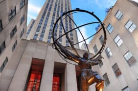 Image of the Statue of Prometheus at Rockefeller Center on Fifth Avenue with tall building in the background