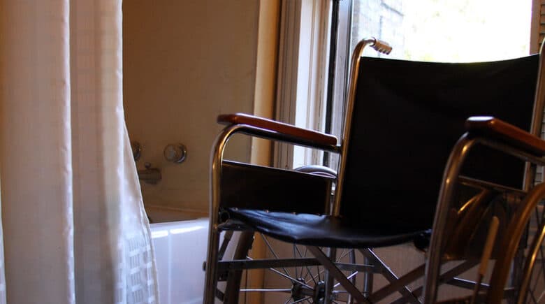 Wheelchair inside a hotel room bathroom