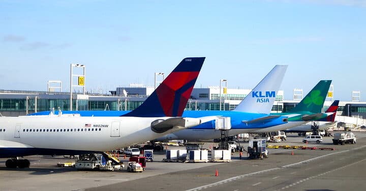 Delta, KLM (Asia) and Aer Lingus planes parked at New York's JFK airport terminal 4