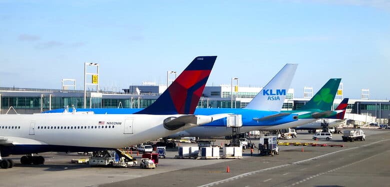 Delta, KLM (Asia) and Aer Lingus planes parked at New York's JFK airport terminal 4