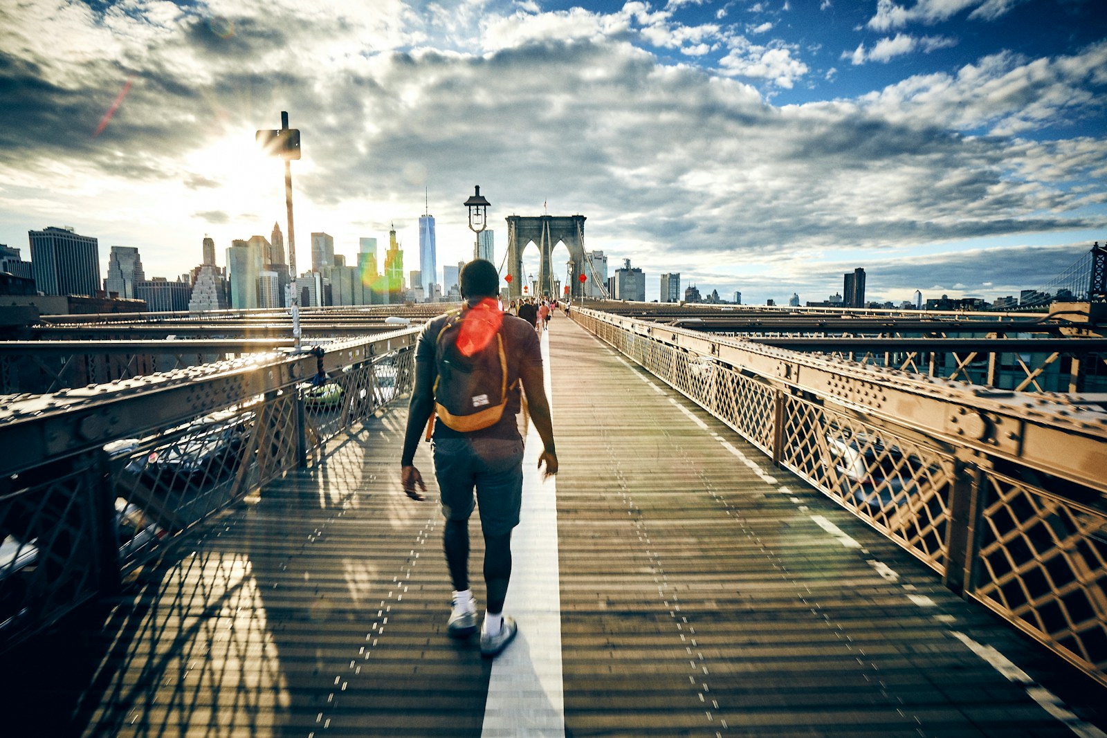 man walking on bridge