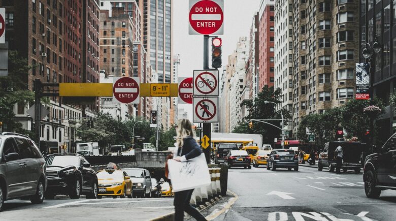 woman walking on road in new york