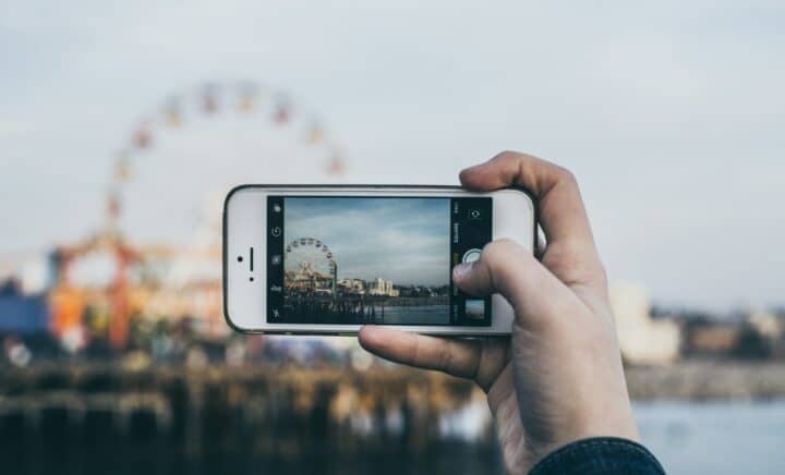 person taking picture Ferris Wheel