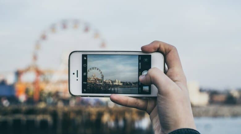 person taking picture Ferris Wheel