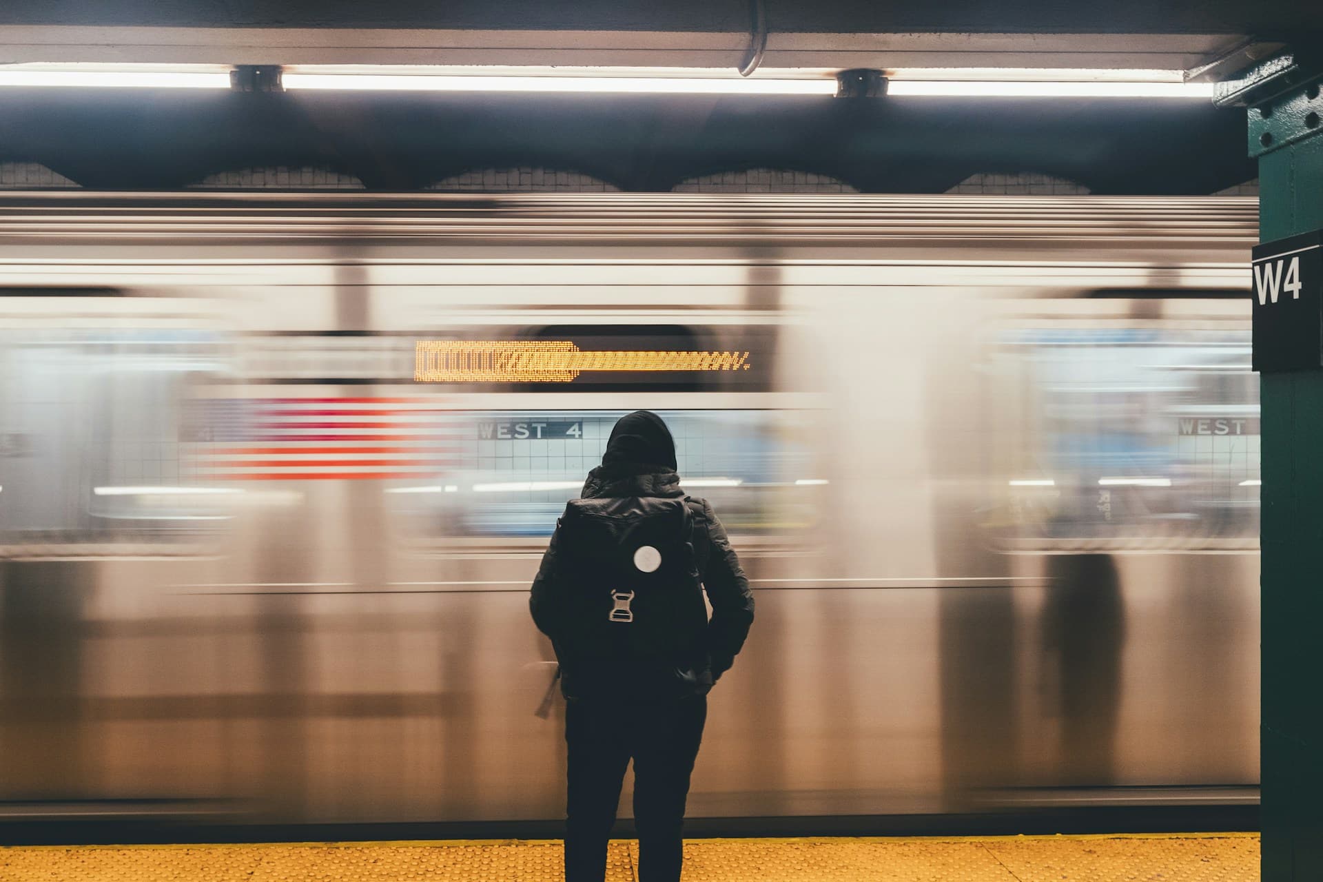 woman waiting for train in NYC