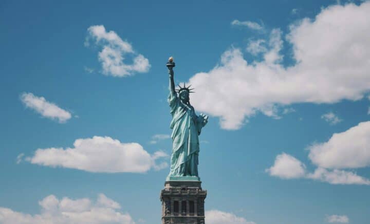 statue of liberty with blue sky in the background