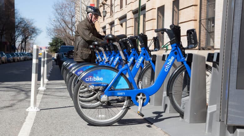 A man rents a bicycle from Citibank's Citibike bicycle share program