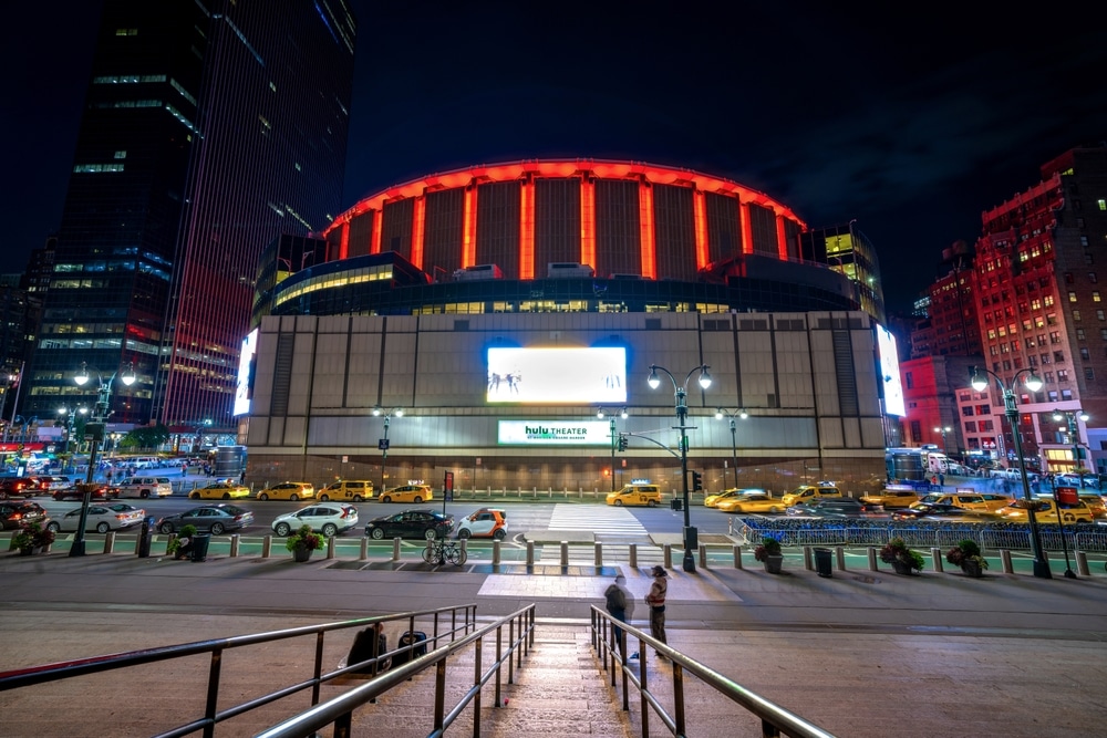 Experience 24 Hours in FiDi by seeing the night view of Madison Square Garden, showcasing the iconic arena in Manhattan, NYC