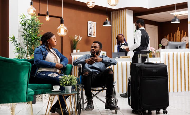 woman-and-disabled-man-in-hotel-lobby-in-nyc