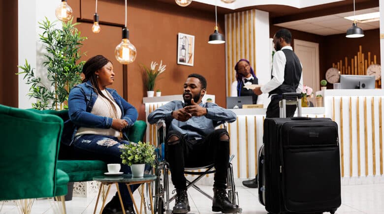 woman-and-disabled-man-in-hotel-lobby-in-nyc