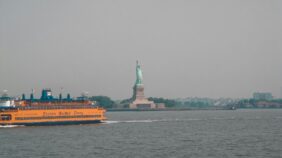 Staten Island Ferry In front of the Statue of Liberty