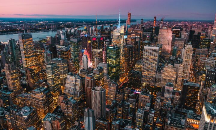 lighted high-rise buildings during golden hour