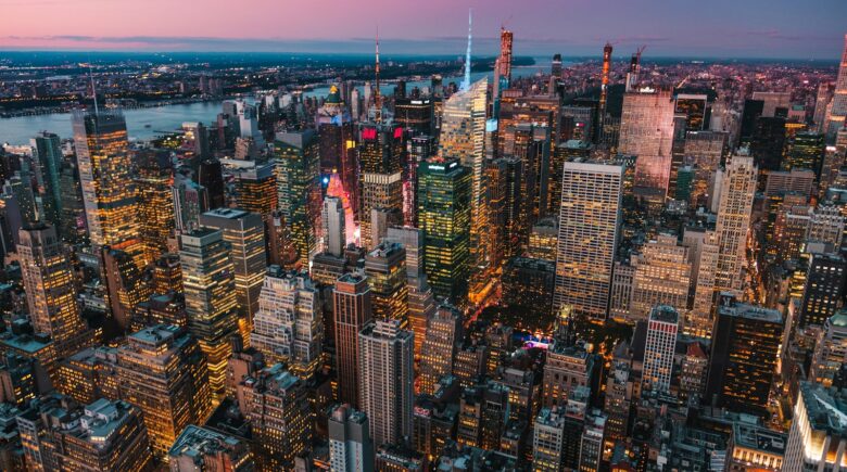 lighted high-rise buildings during golden hour