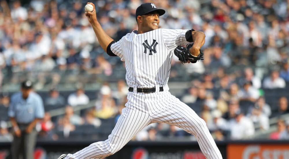 New York Yankees relief pitcher Mariano Rivera (42) pitches against the Colorado Rockies at Yankee Stadium