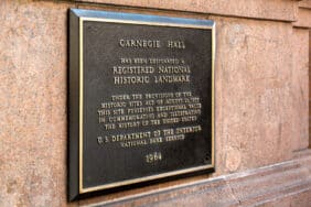 Historic Landmark sign on the wall outside Carnegie Hall