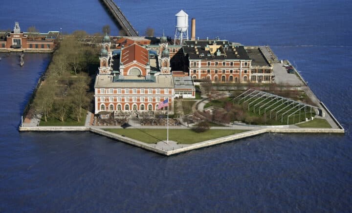 Ellis Island seen from above appears incredibly beautiful surrounded by water