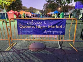 Sign Welcoming You to the Queens Night Market in Flushing Meadows Corona Park in NYC