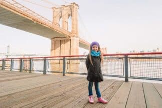 Little girl on Brooklyn bridge, New York city NYC, Manhattan, USA.
