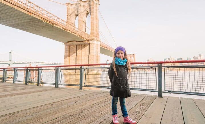 Little girl on Brooklyn bridge, New York city NYC, Manhattan, USA.