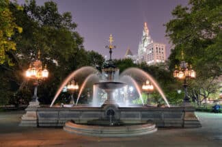 The fountain in City Hall Park in Lower Manhattan at twilight