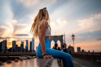 Woman enjoying the view from the Brooklyn Bridge