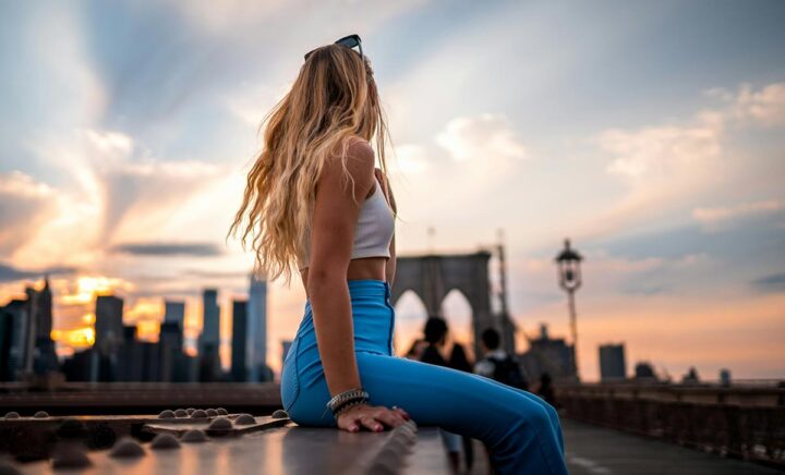 Woman enjoying the view from the Brooklyn Bridge