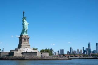 The Statue of Liberty at New York City on clear sunny day