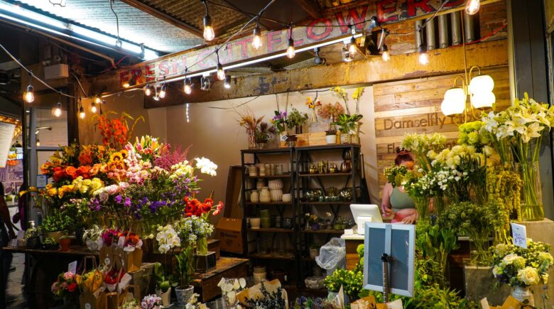 A flower shop filled with lots of different types of flowers in Chelsea Market
