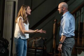 Natalie Gold and Corey Stoll in Appropriate, engaged in a heated discussion by the stairs