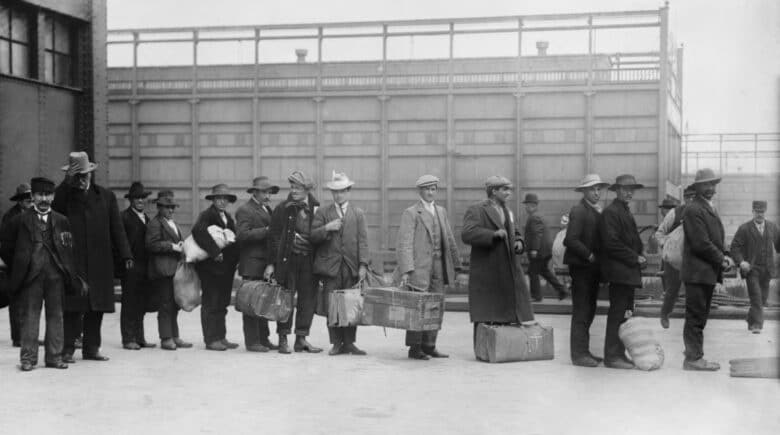 Italian men await admission processing at Ellis island