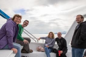 A family enjoying a boat tour during the holidays