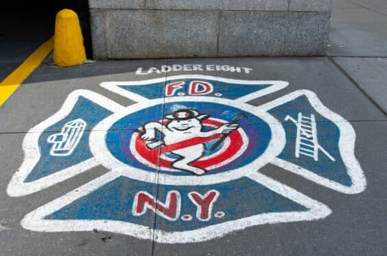 The Ghostbusters logo on the sidewalk in front of the firehouse