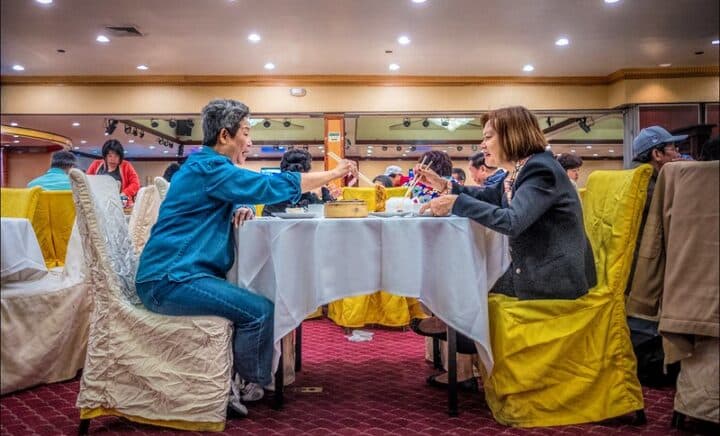 Women enjoying chinese food in a restaurant in Chinatown, NYC