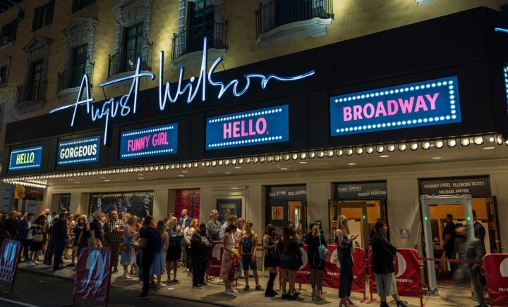 View of people in line to watch famous musical at August Wilson theater on Broadway, Manhattan, New York. USA. 09.22.2022.