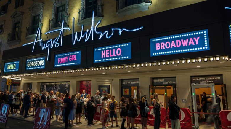 View of people in line to watch famous musical at August Wilson theater on Broadway, Manhattan, New York. USA. 09.22.2022.