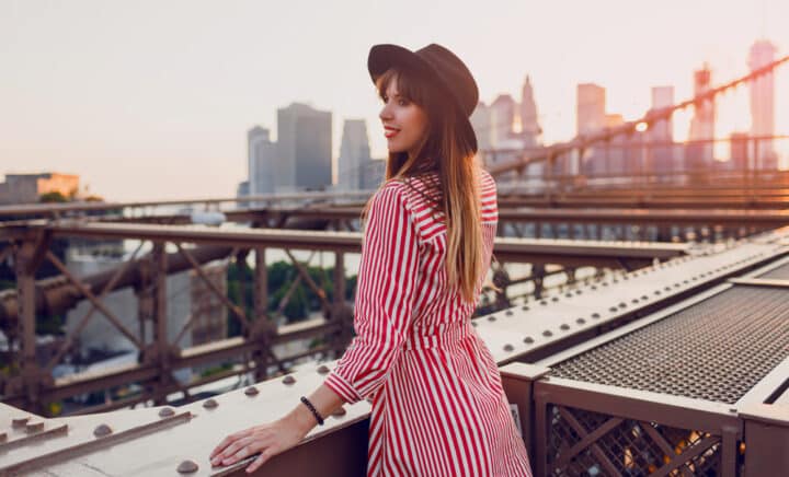 A woman enjoying amazing view from Brooklyn bridge in New York