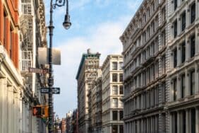 Old buildings at the intersection of Broome and Wooster Streets in the SoHo neighborhood of New York City NYC