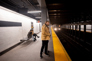 a young adult traveling by metro