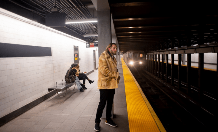 a young adult traveling by metro