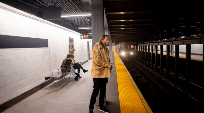 a young adult traveling by metro