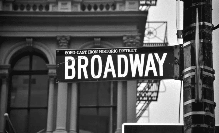 The place where must-see Broadway plays are taking place on a daily basis, a black and white sign reads: SOHO-CAST IRON HISTORIC DISTRICT BROADWAY