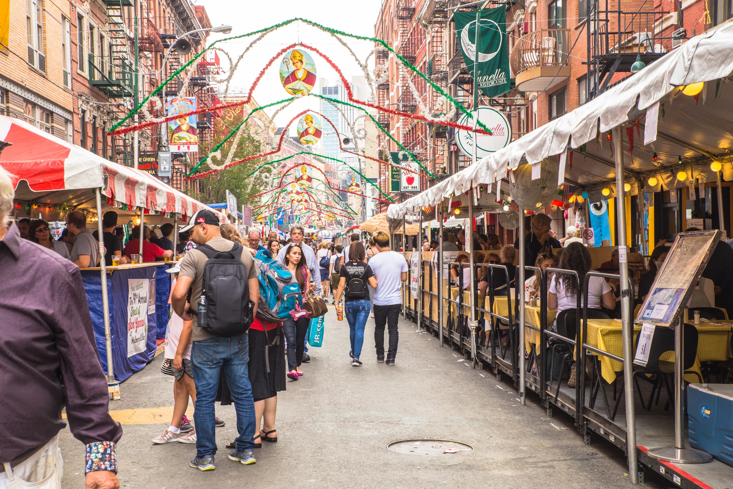 NEW YORK CITY - SEPTEMBER 21, 2017: View of the Annual Feast of San Gennaro street festival on the street of Little Italy in Manhattan with food vendors, decorations and real people in view.