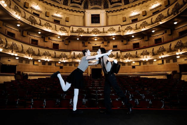 couple dancing in an empty auditorium found using NYC travel guide