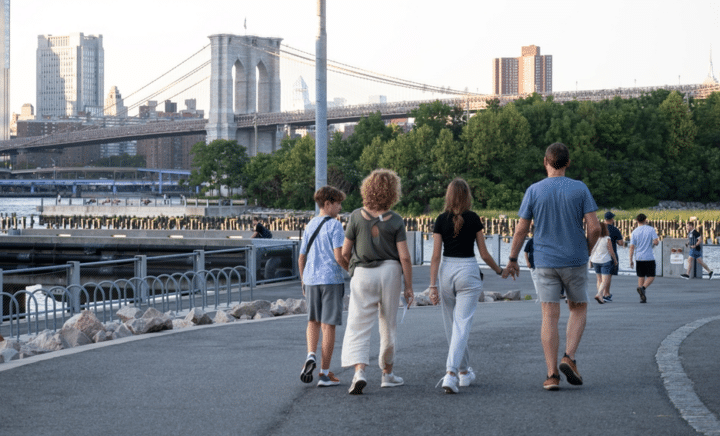 family walking in a park in NYC