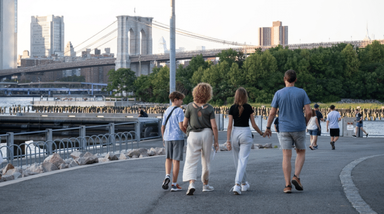 family walking in a park in NYC