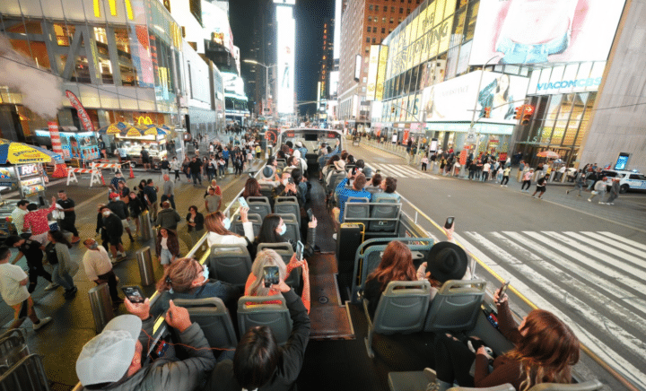 People on a bus touring the Times Square