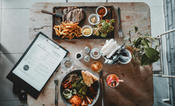 A variety of delicious dishes and beverages spread across a café table in New York City