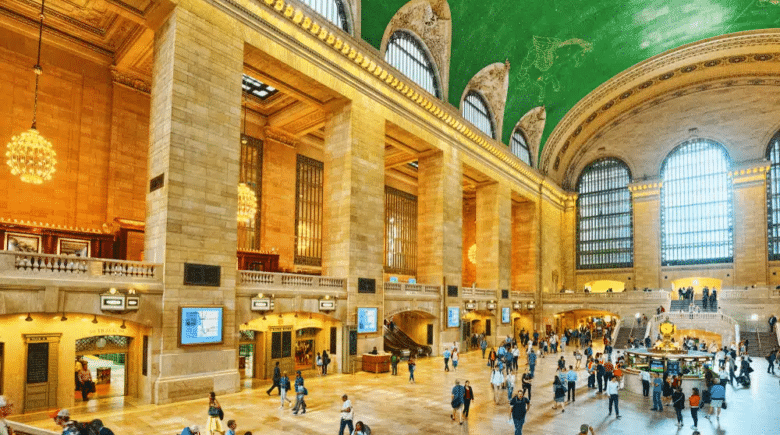 People walking around in the foyer of Grand Central Station, which is where the unique NYC day tour starts.