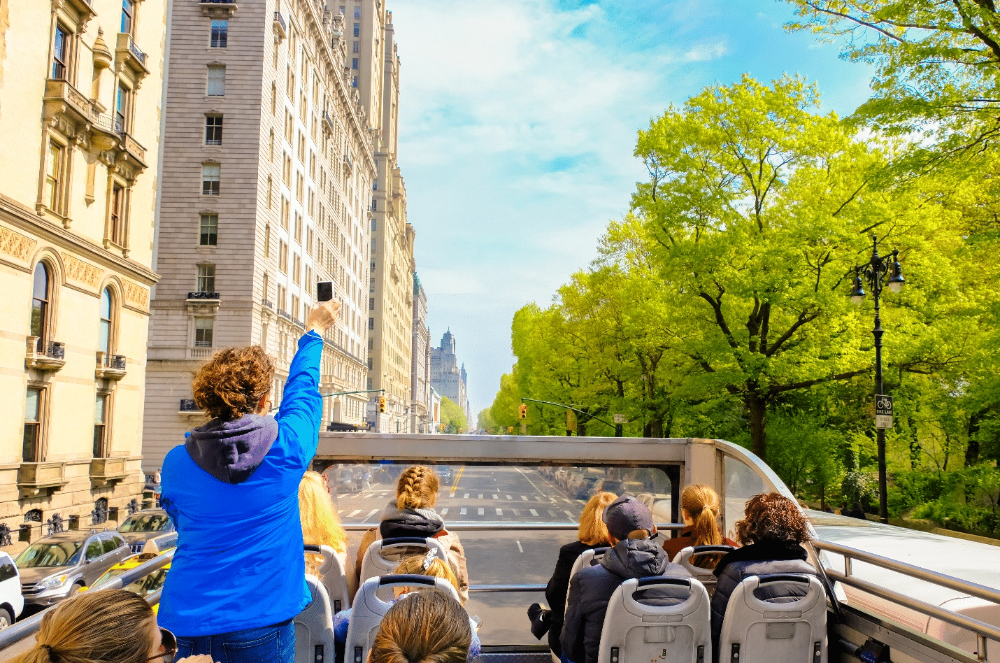 People at the top of a bus during a small group tour in New York City